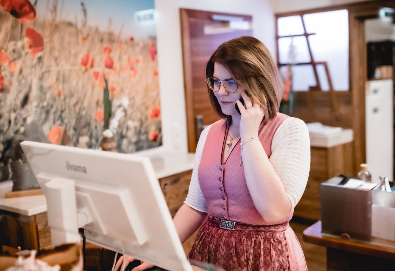 Lady at the reception desk in the hotel