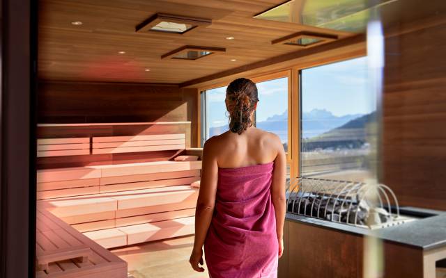 Woman saunas with panorama